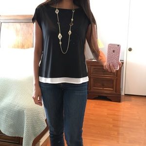 Flowy asymmetrical blouse in the back